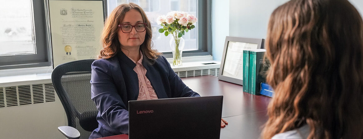 Monica Saran-Nace meeting with a client in her office