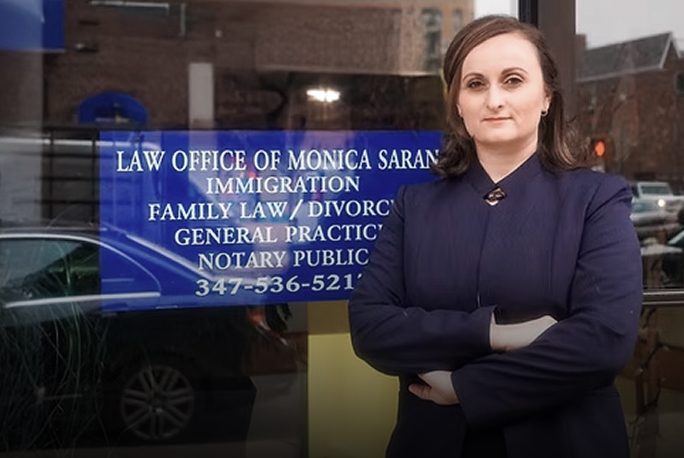 monica standing in front of signs